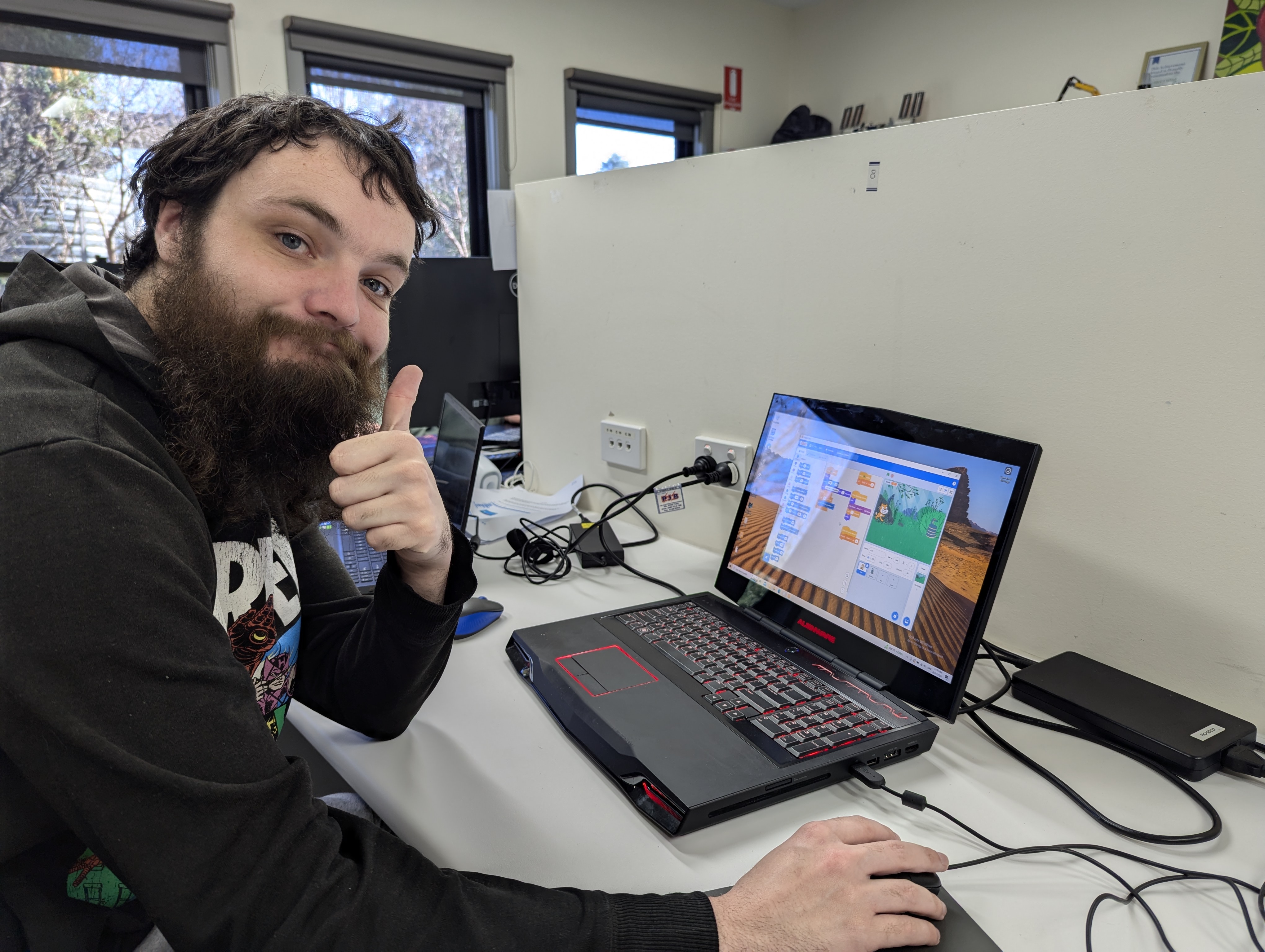 A man thumbs up showing Computer skills at Distinctive Options Noweyung