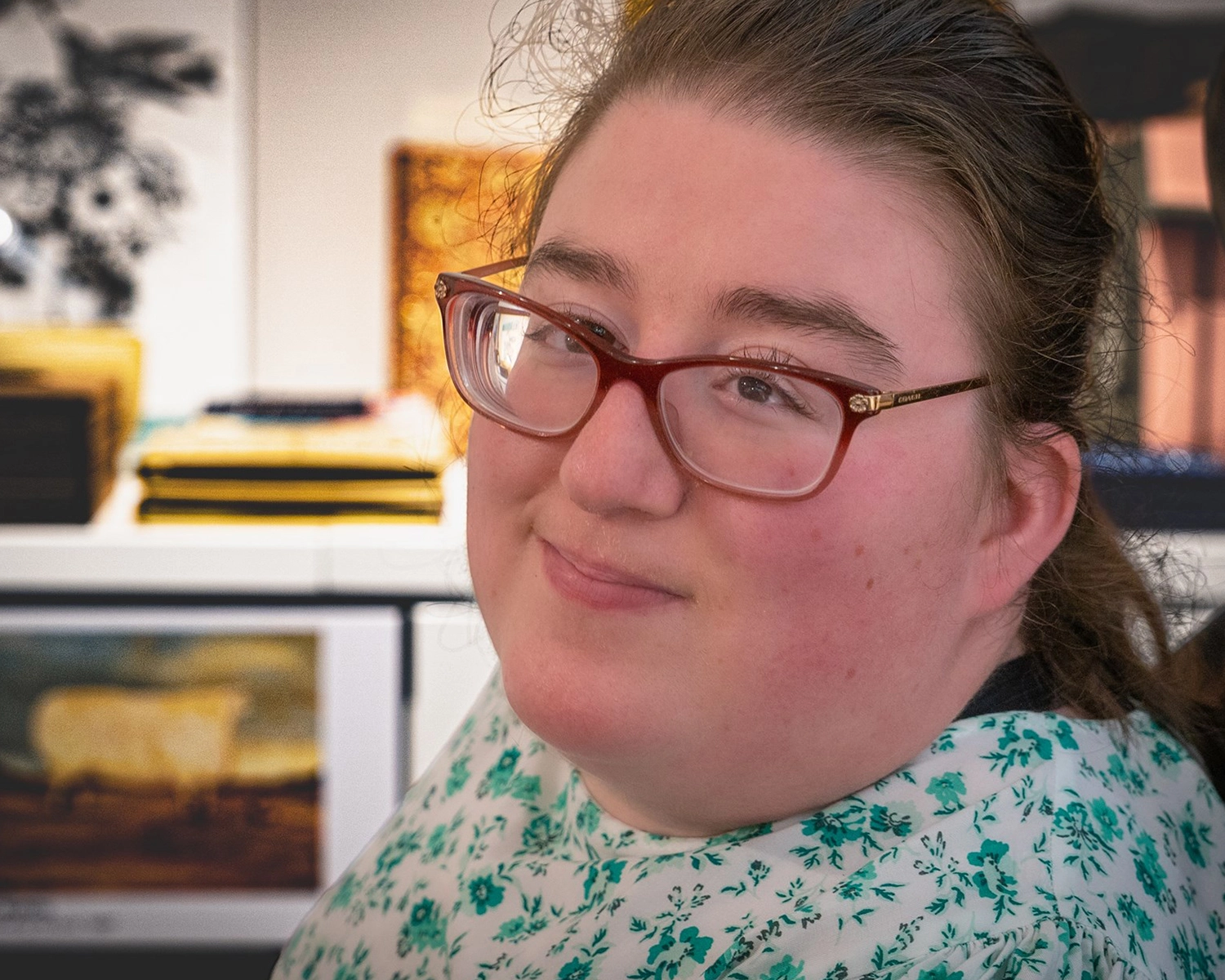 A woman in a wheelchair in an art gallery gift shop Distinctive Options