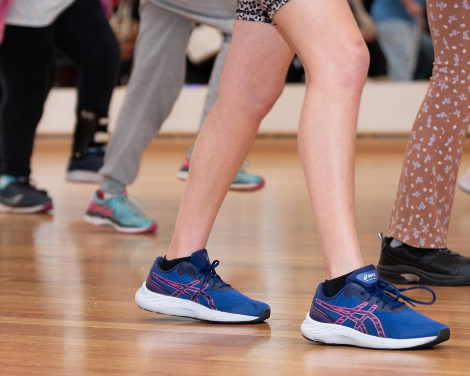 Dancing feet on a timber dance floor at dance class