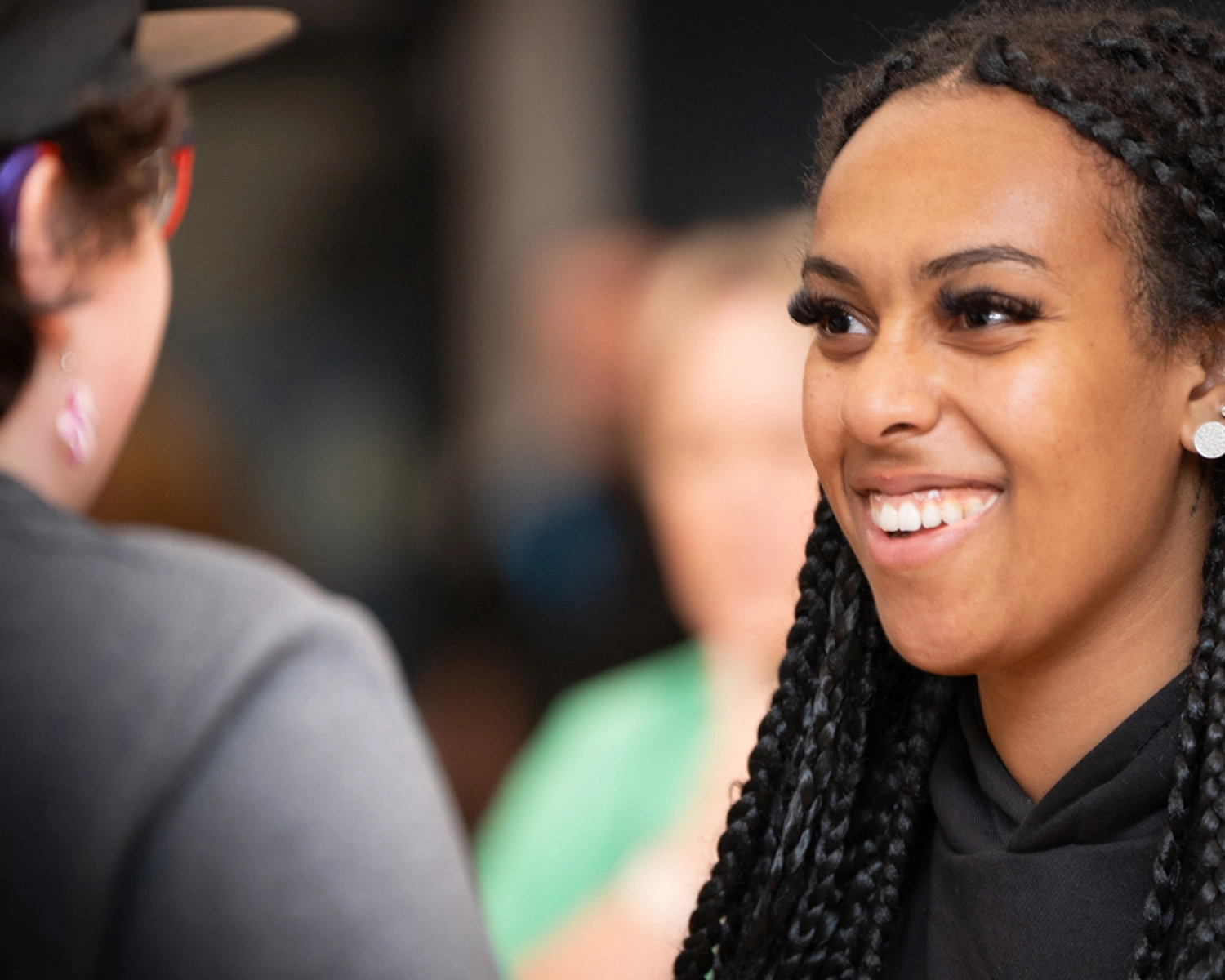 Two women smile in a dance class at NDIS registered disability support Distinctive Options