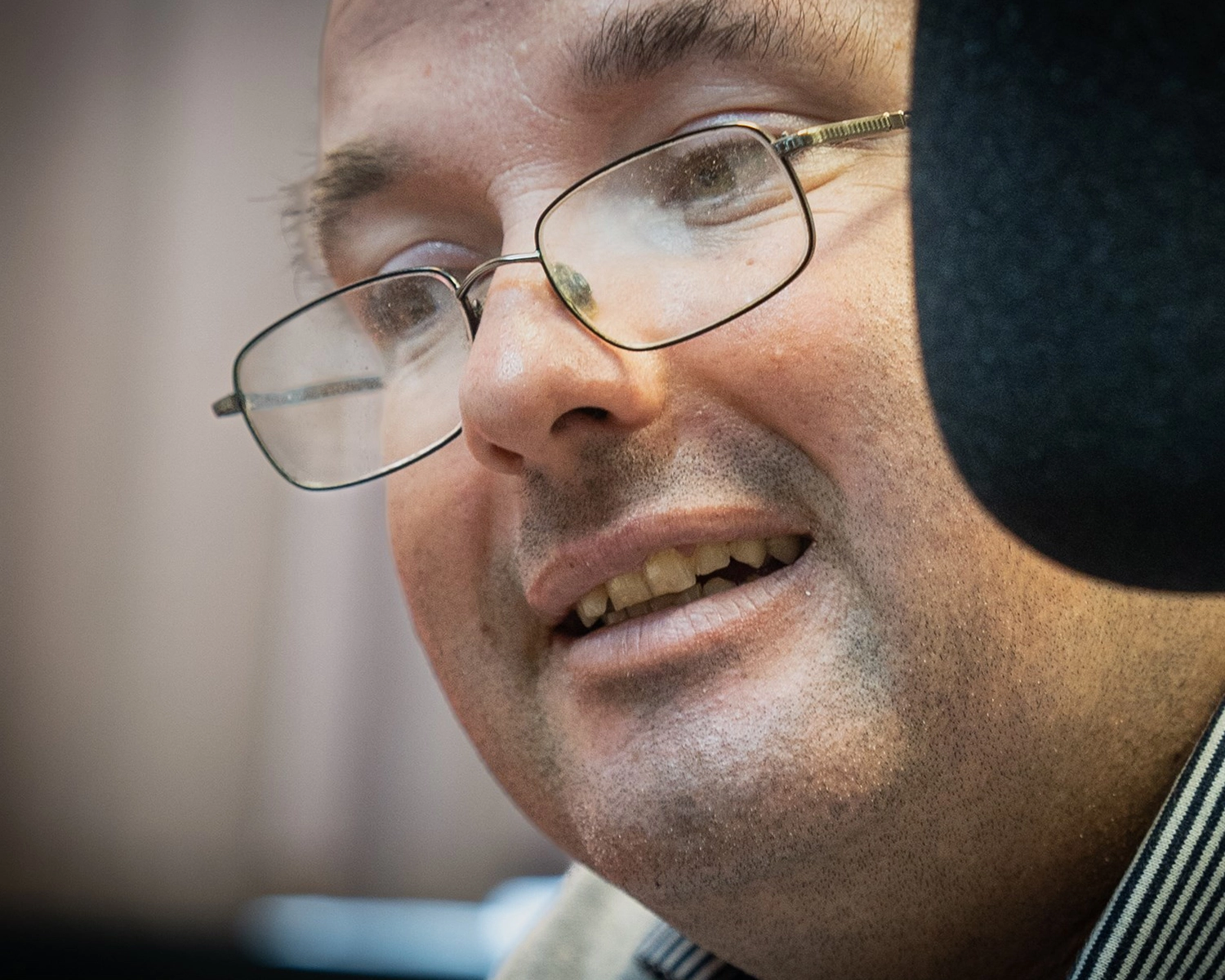 A man speaks into a radio microphone