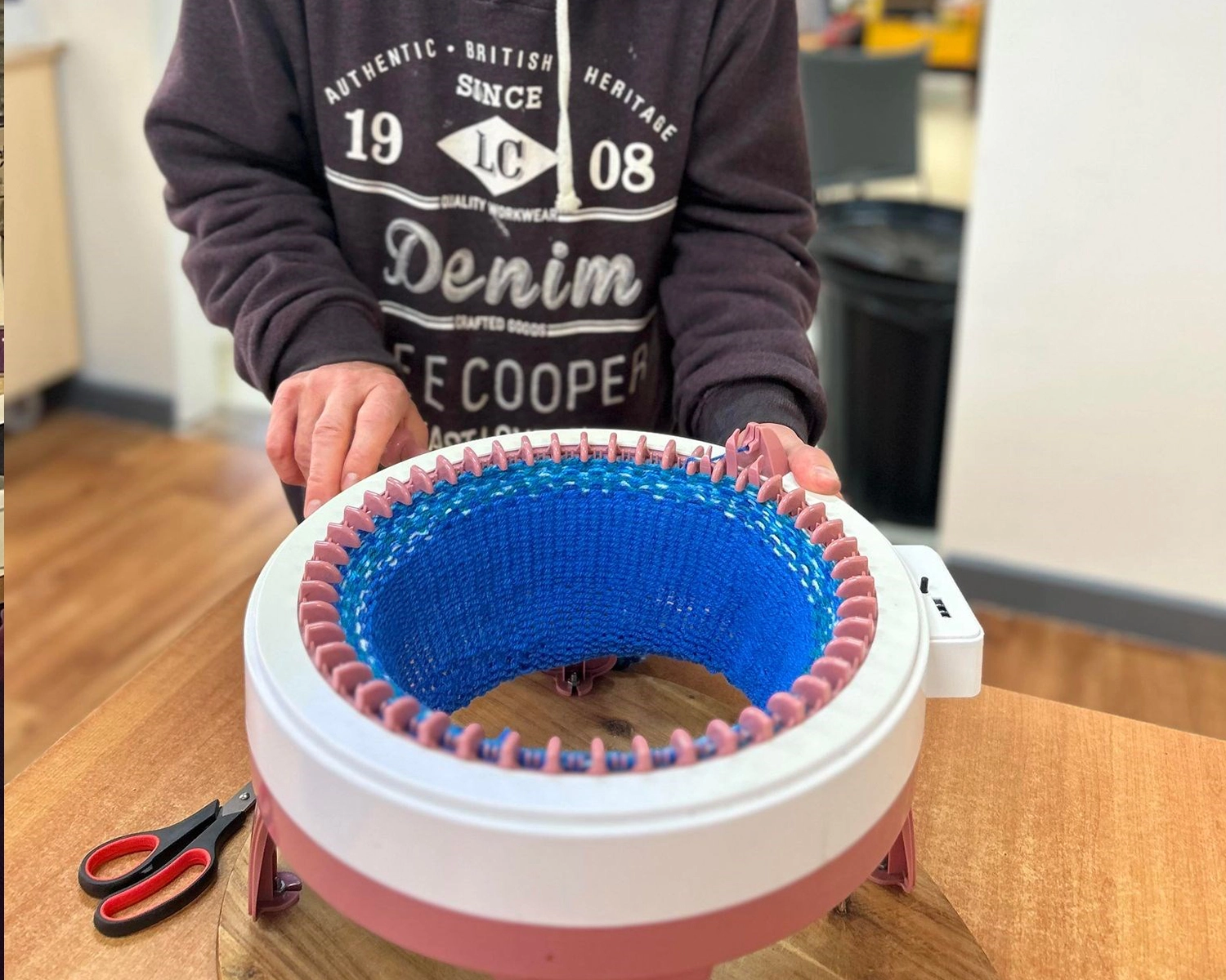 A man makes a basket at NDIS registered disability service Distinctive Options