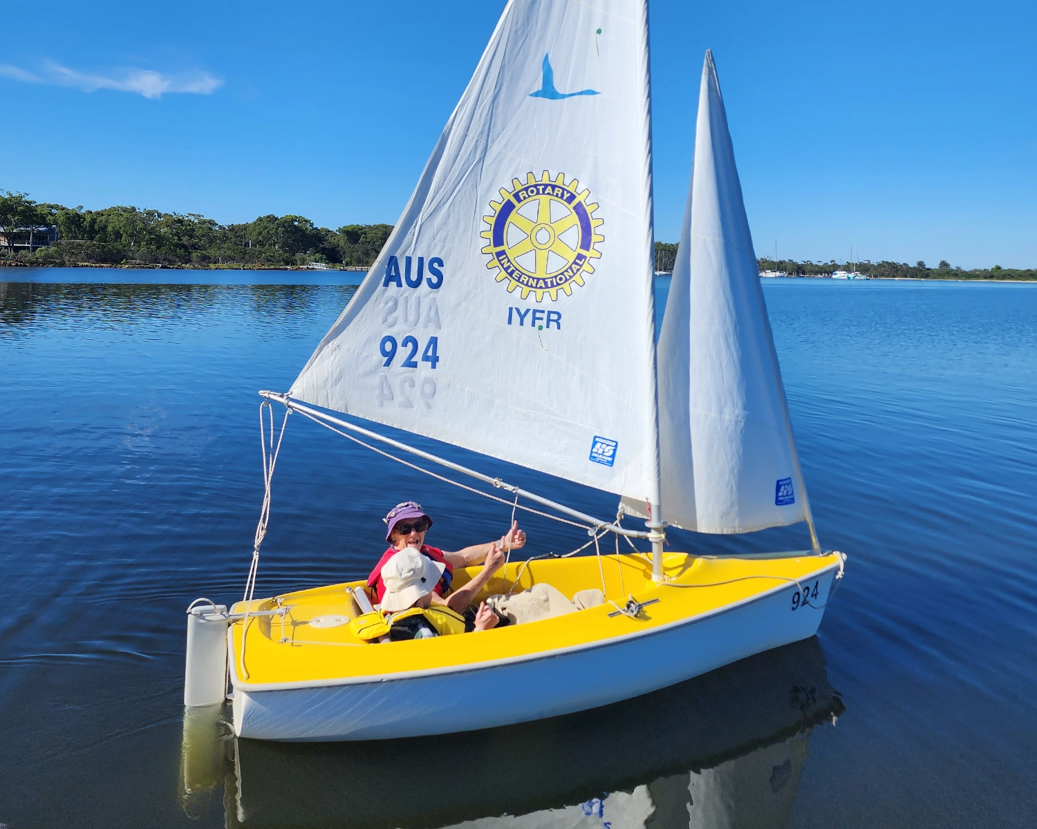 Two people in a small boat go Sailing at Distinctive Options Noweyung Bairnsdale