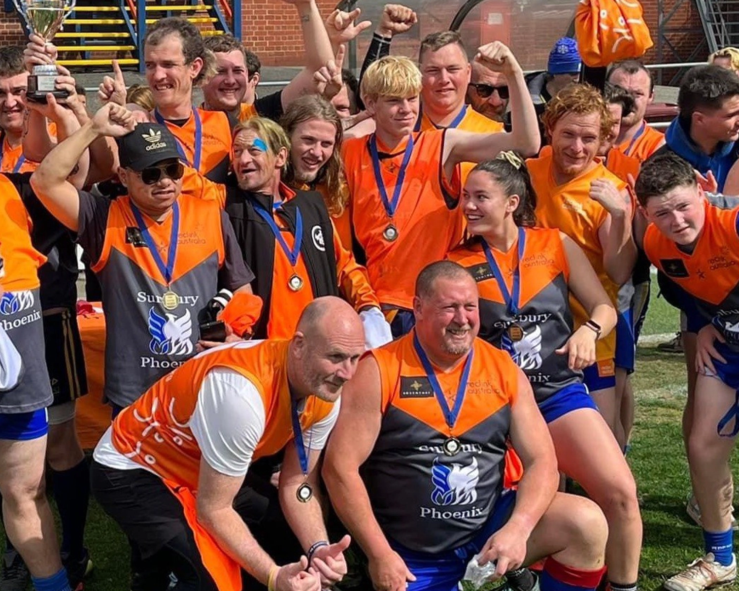 a group of peeopl wear sports clothing and cheer on a sports ground at Reclink Sports Distinctive Options