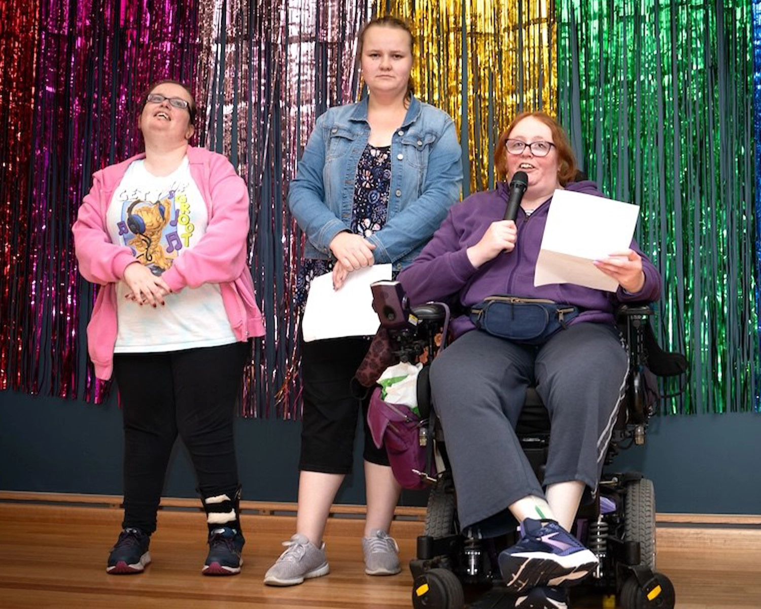 3 people give presentation at NDIS registered disability support Distinctive Options