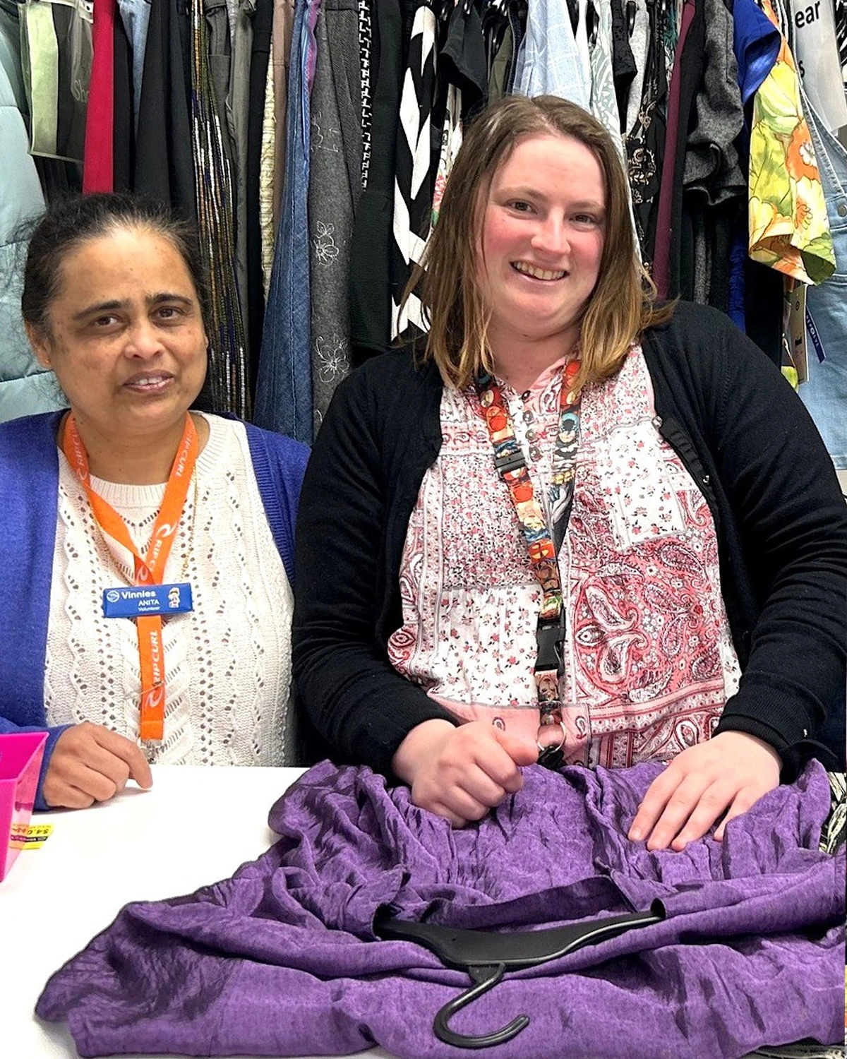 Two women stand in a clothing store at NDIS registered disability service Distinctive Options
